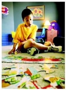 Can Melatonin Cure Autistic Children boy with jigsaw puzzles