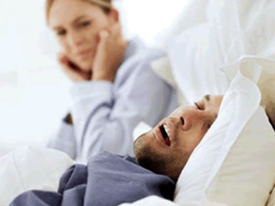 Man Snoring With Sleep Apnea